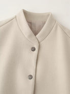 Beige wool single breasted cardigan with silver buttons and mandarin collar