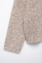 Elegant Langry beige fuzzy knit scarf with floral button pattern
