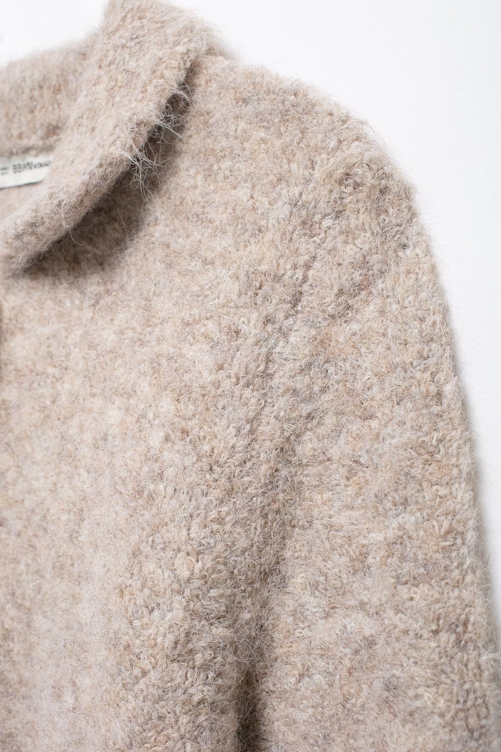 Elegant Langry beige boucle sweater with floral button knit design