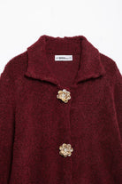 Elegant knitted cardigan in burgundy boucle with floral buttons and collar detail, langry fashion ملابس