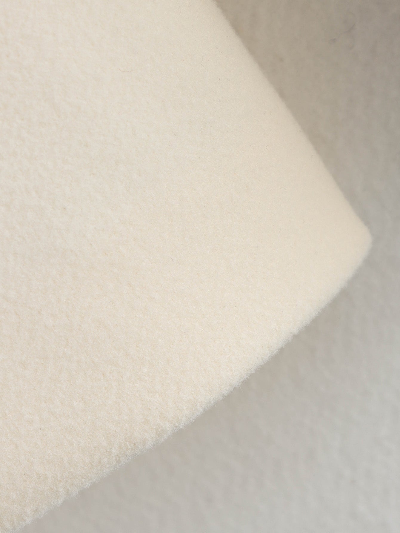 White fluffy bath sponge with textured foam surface for Langry fashion ملابس