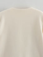 Cozy Langry cream crew neck woolen sweater with ribbed cuffs