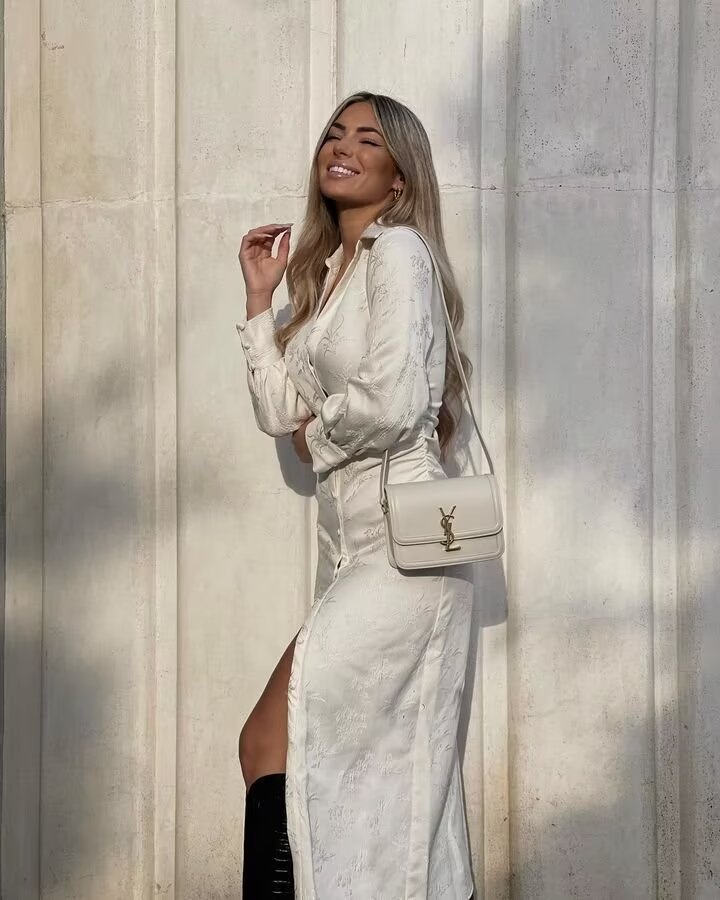 Elegant white Langry V-neck jacquard drawstring dress with high slit and YSL crossbody bag