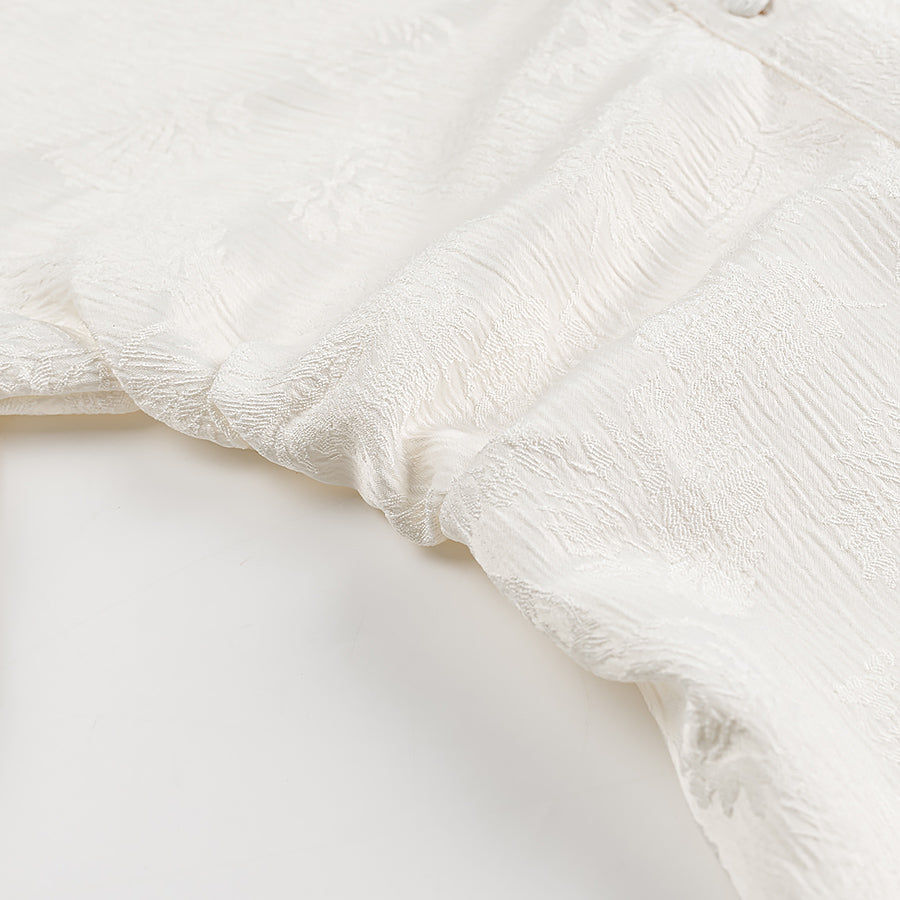 White lace floral fabric with frayed edges in Langry fashion dress