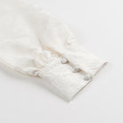 Elegant Langry fashion dress with white fur coat, pom-poms, lace detailing