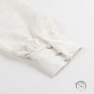 Langry fashion white fur coat with pom-poms on V-neck jacquard dress