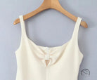 Stunning retro backless dress in white langry fashion with bow neckline on hanger