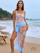 Floral one piece swimsuit with light blue sarong wrap in orange pink tropical print