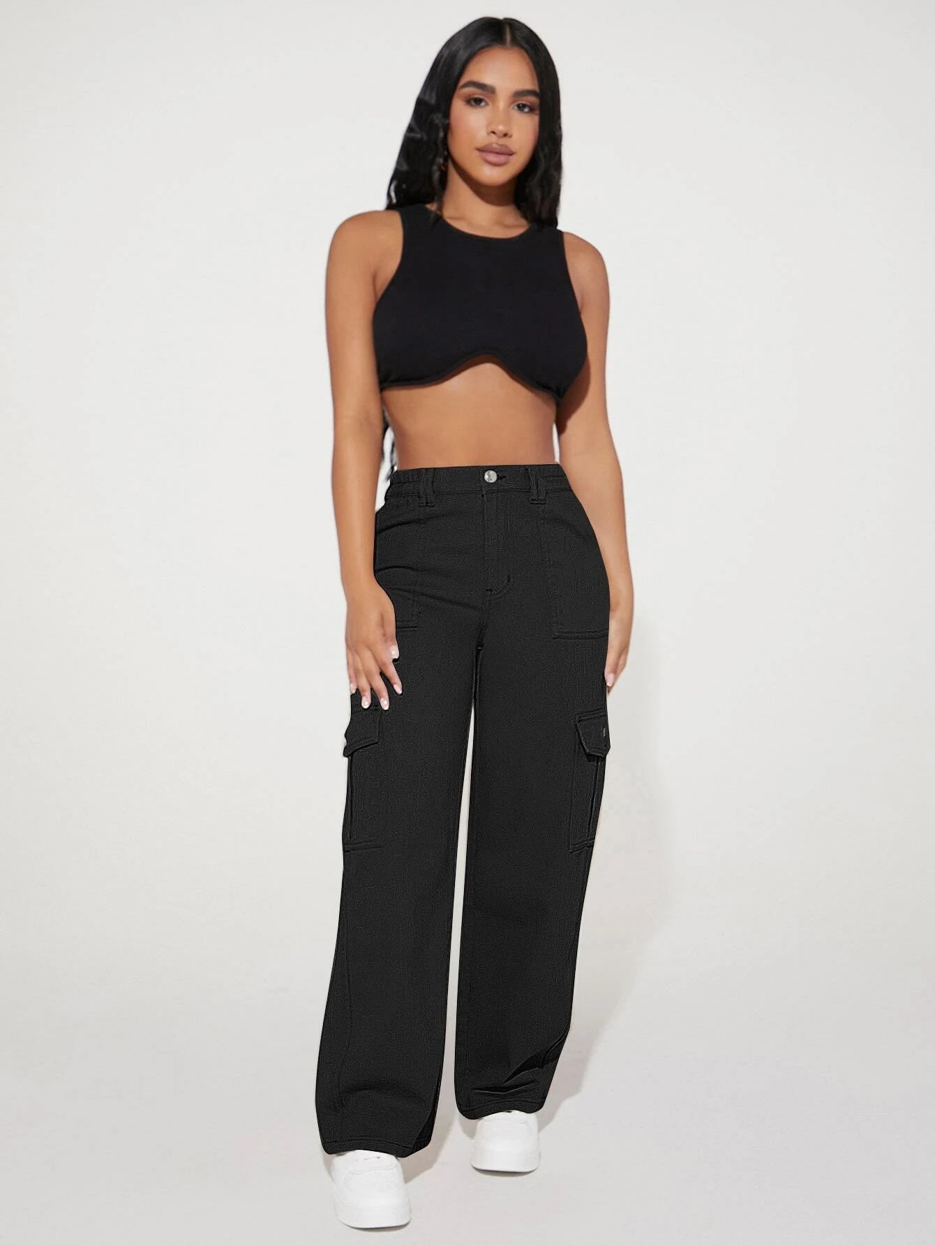 Woman in black crop top and cargo pants showcasing Cute Casual Pants fashion ملابس