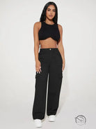 Woman in black crop top and cute casual pants