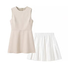 Elegant beige sleeveless langry fashion dress with pleated skirt