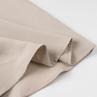 Elegant langry beige satin skirt with ruffled hem in fashion two-piece set