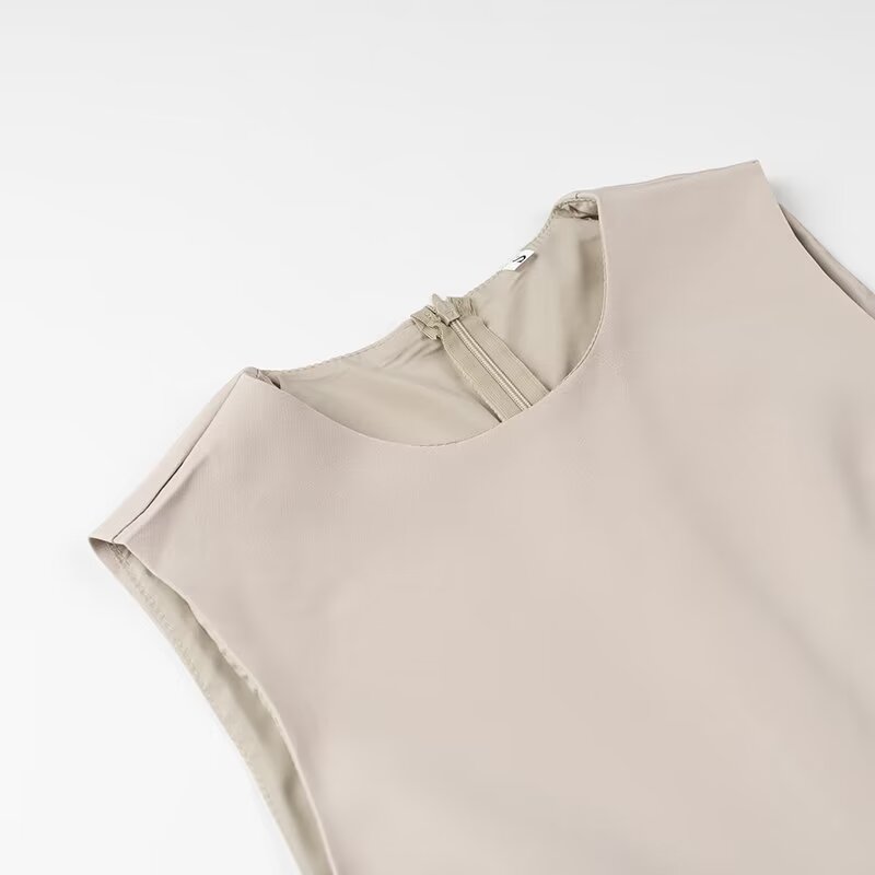 Elegant beige sleeveless langry fashion blouse with ruched neckline