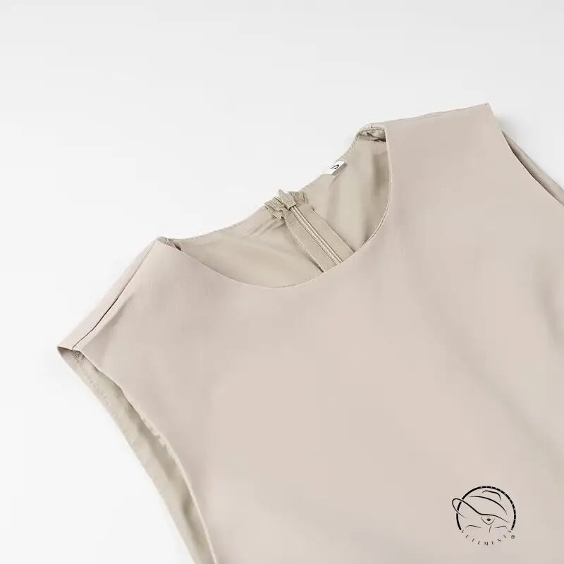 Elegant beige sleeveless langry fashion blouse with ruched neckline