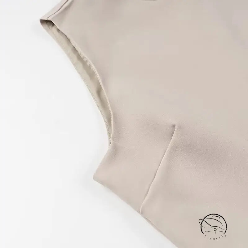 Elegant beige sleeveless langry fashion top with high neckline and elastic waistband