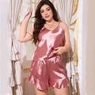 Pink satin langry pajama set with ruffled hem and spaghetti straps