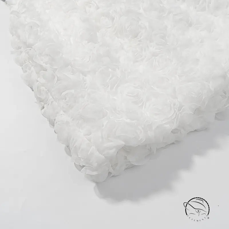 White fluffy bath mat with early spring floral three dimensional texture