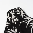 Black and silver floral scarf with metallic accents on langry fashion dress