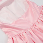 Elegant pink satin langry fashion dress with ruffled hem and square neckline