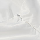 Elegant white satin Langry fashion dress with lace trim and silver button