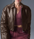 Loose thick warm short brown satin bomber jacket in faux leather fashion
