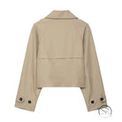 Beige double breasted short trench coat with buttoned cuffs