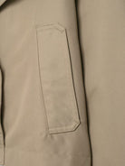 Langry double breasted beige canvas laptop sleeve with white stitching and pocket