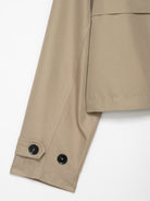 Casual double breasted short trench coat in beige with black buttons