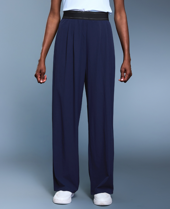 Navy blue langry fashion wide-leg pleated trousers with black waistband and white sneakers