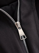 Silver zipper with black fabric and metallic teeth on Langry fashion jacket