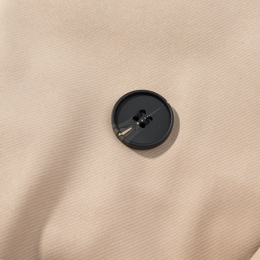 Casual long sleeve belt short trench coat with black button on beige fabric