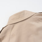 Casual long sleeve belt short trench coat in beige with double-breasted fashion design