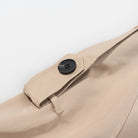 Beige canvas tote bag with black button closure, Langry fashion accessory for ملابس