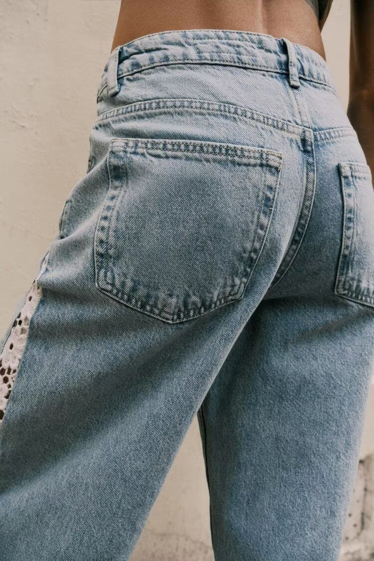 Light blue wide leg jeans with leopard patch on back pocket