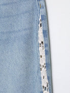 Light blue H&M wide leg jeans with crochet lace hem detailing
