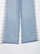 Light blue Zara wide leg jeans with white lace trim and crochet stitching