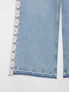 Light blue wide leg jeans with lace trim and black polka dots