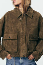 Brown suede leather bomber jacket with pockets and button closure