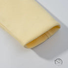 Yellow leather wristband in langry fashion, textured pattern, rolled edge