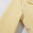 Yellow fleece sweatpants with pocket detail in Langry fashion coat