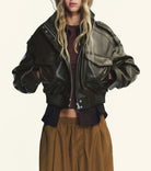 Black faux leather bomber jacket with polo collar and zipper details