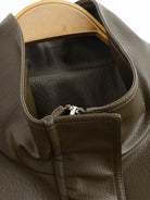 Langry faux leather jacket with olive green duffle bag