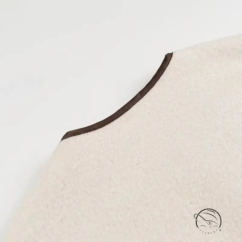 Cozy lace up coat with cream-colored felt hat and brown trim