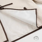 Cozy lace up coat with white and brown trim zippered pouch