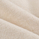 Cozy Langry lace-up coat with cream-colored plush fuzzy blanket texture