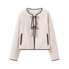 Cozy Langry lace-up coat in cream with black trim, fashion ملابس