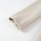 Beige fleece-lined arm warmer with elastic cuffs in Langry fashion trench coat