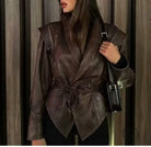 Fashionable faux leather jacket with high collar and tie waist
