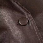 Fashionable Langry faux leather jacket with large buttons and textured brown surface