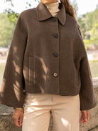 Langry fashion brown wool cape with button closure and patch pockets